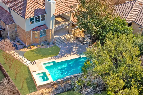 an aerial view of residential houses with city view