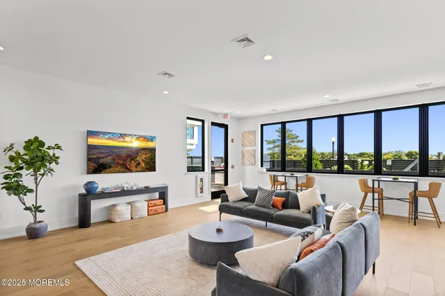 a living room with fireplace furniture and a flat screen tv