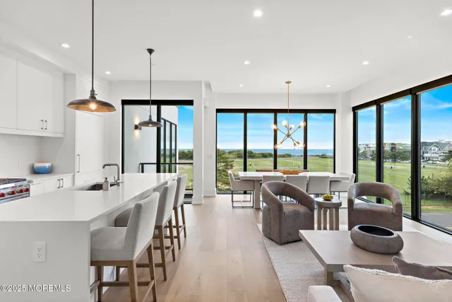 a large kitchen with a large window and furniture