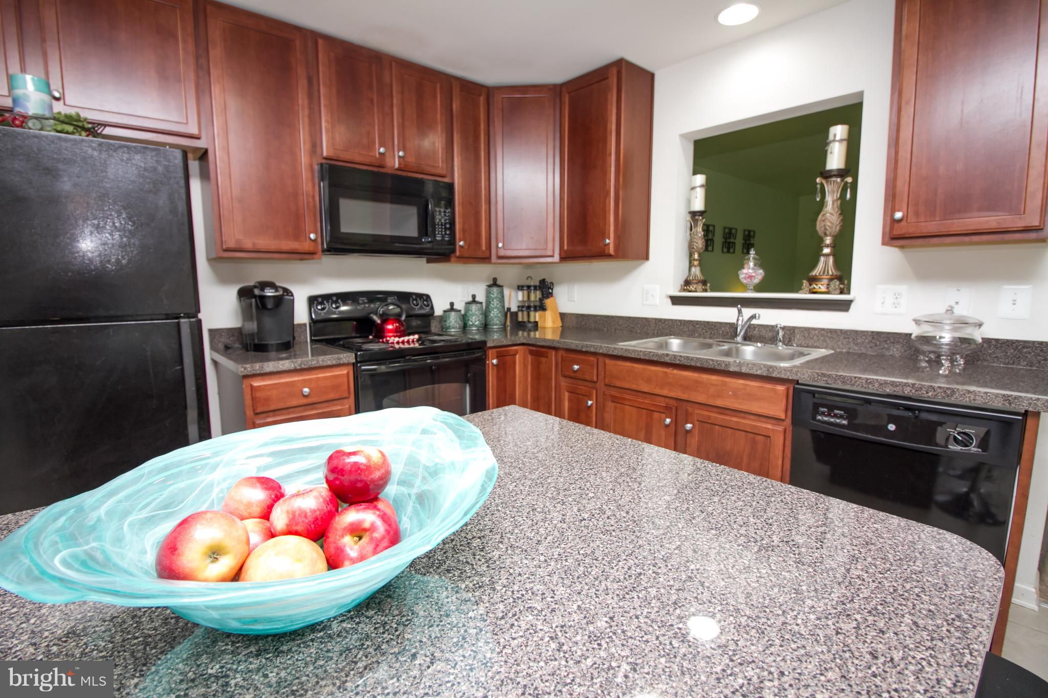 1217 Mare Street Ranson, WV 25438 - Photo 5 of 23 a kitchen with a sink a stove and refrigerator