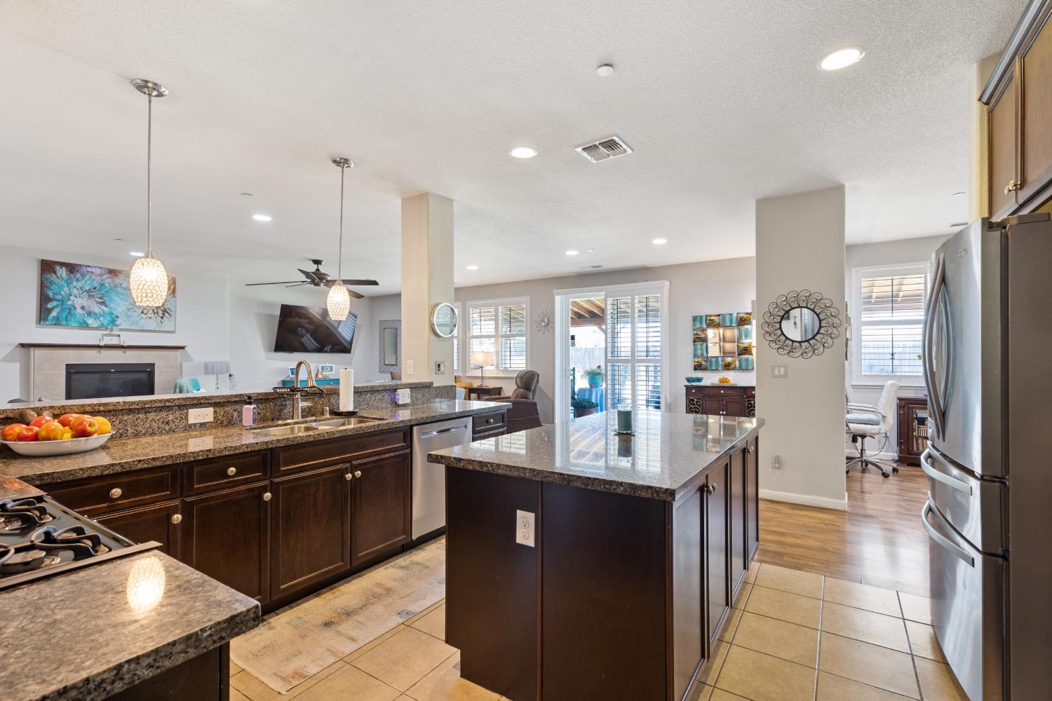 2011 Roy Ranch Way Plumas Lake, CA 95961 - Photo 13 of 49 a kitchen with stainless steel appliances granite countertop a sink a stove and a refrigerator