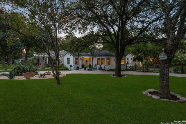 a view of a house with a backyard porch and sitting area
