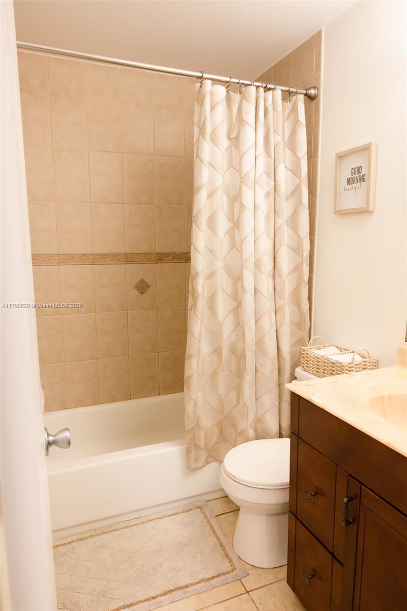 West End Miami, FL 33193 - Photo 11 of 23 a bathroom with a toilet a sink and a bathtub