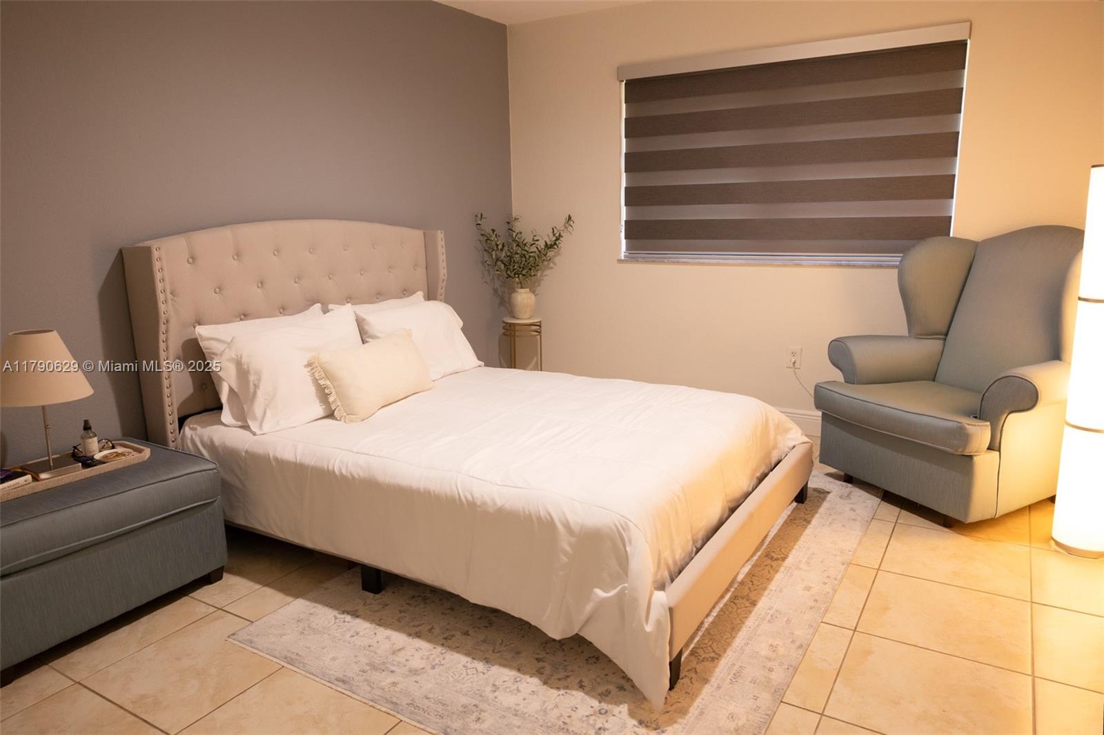 West End Miami, FL 33193 - Photo 12 of 23 a bed room with a bed and a couch