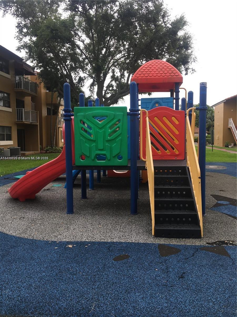 West End Miami, FL 33193 - Photo 23 of 23 a backyard of a house with barbeque oven and outdoor seating