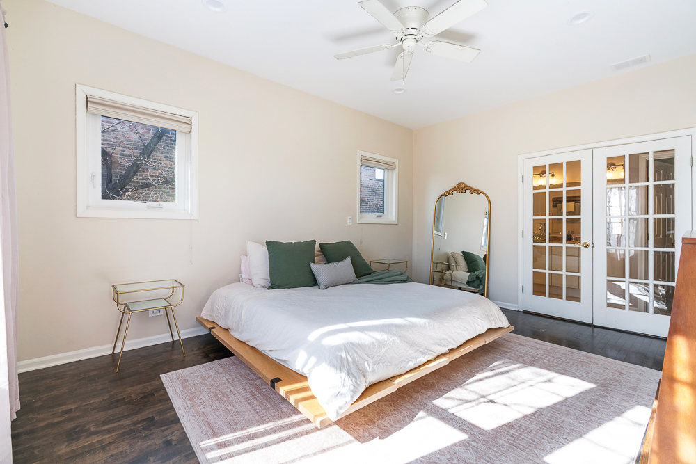 1002 West Altgeld Street, Unit 1002 Chicago, IL 60614 - Photo 13 of 39 a bedroom with a large bed and a window