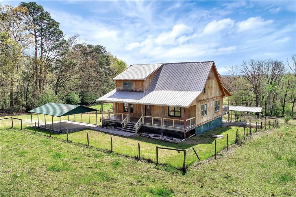 546 Rock Springs Road Lula, GA 30554 - Photo 1 of 1 a white house with a big yard and large trees