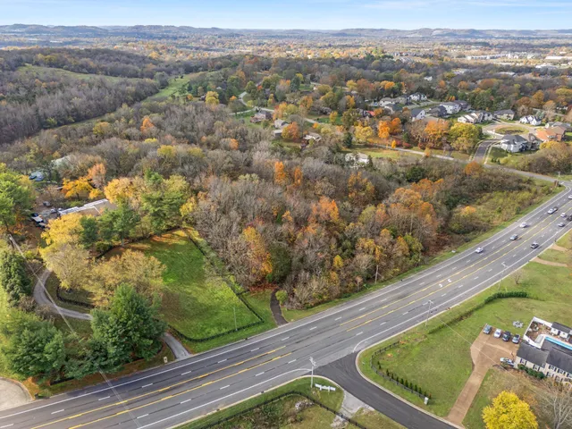 an aerial view of a house with a swimming pool