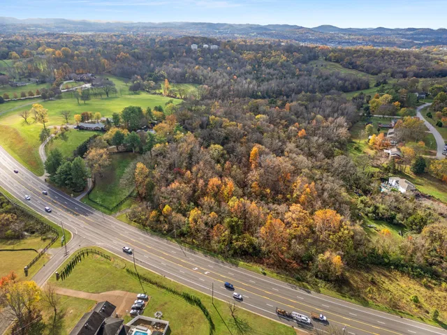 an aerial view of lake residential houses with outdoor space and river