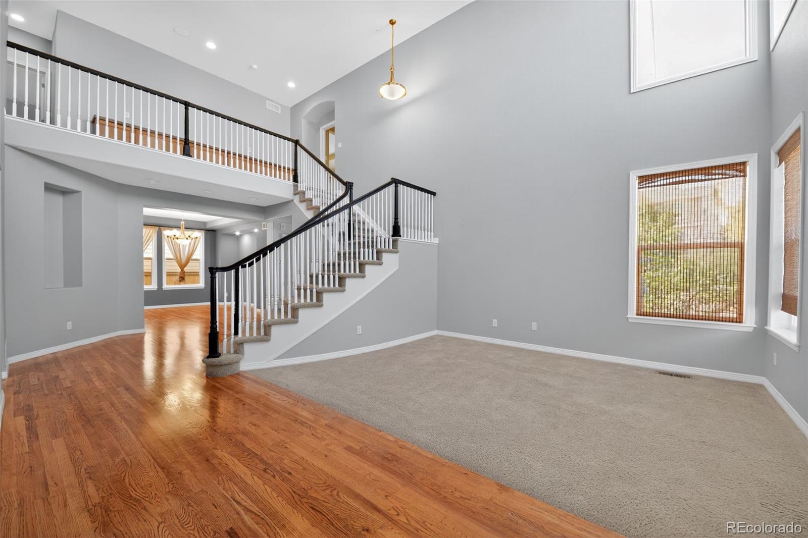 11036 Glengate Circle Highlands Ranch, CO 80130 - Photo 12 of 31 a view of entryway and hall with wooden floor
