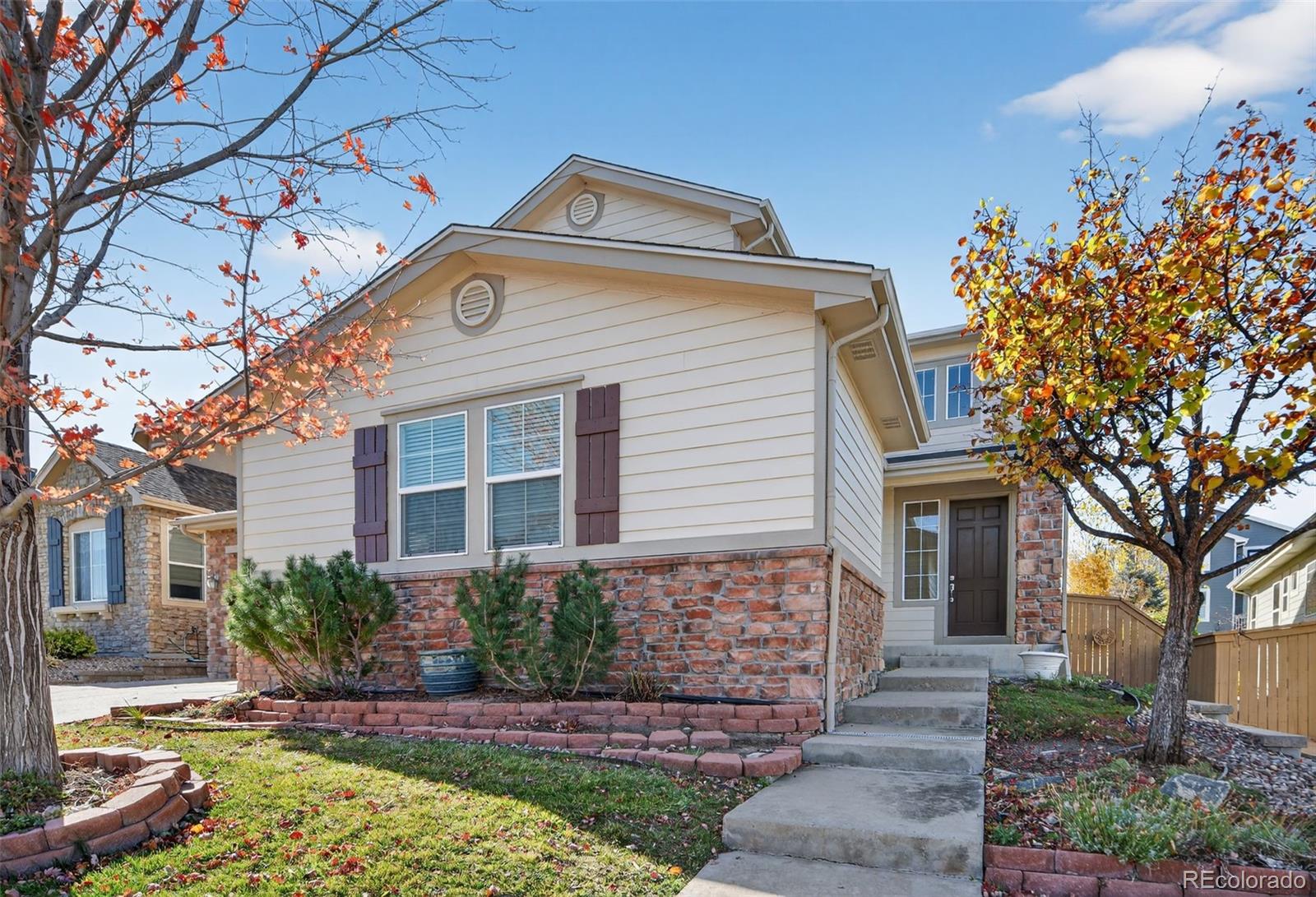 11036 Glengate Circle Highlands Ranch, CO 80130 - Photo 2 of 31 a front view of a house with a yard
