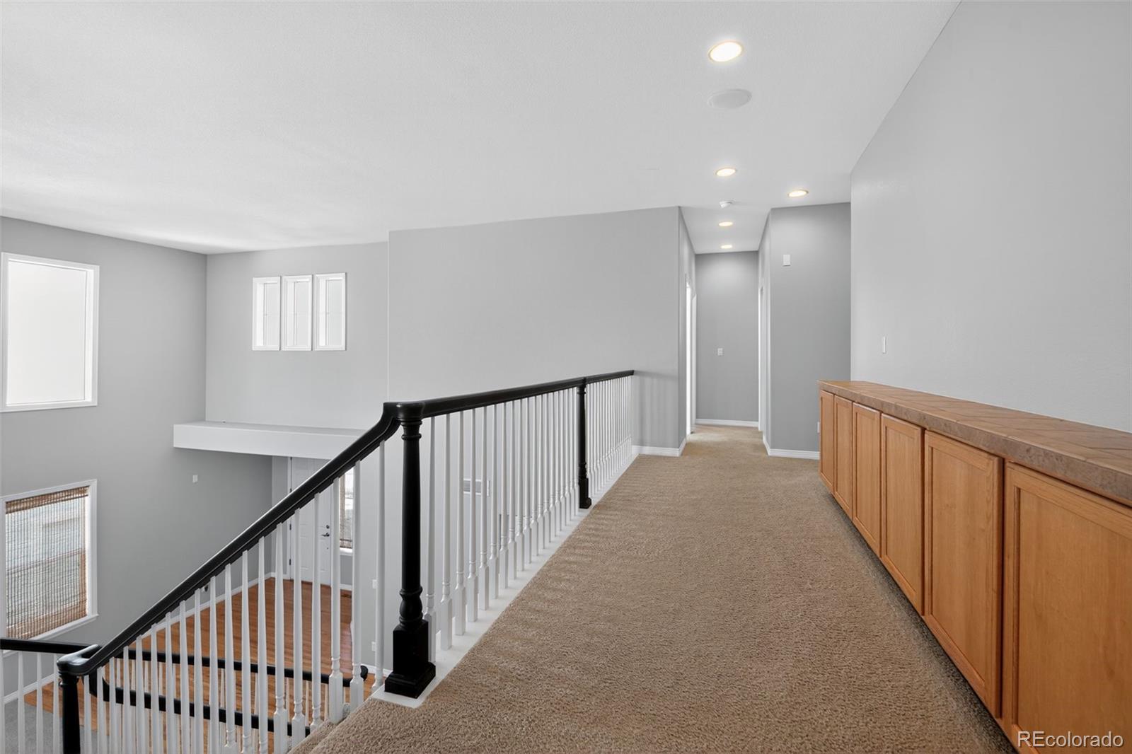 11036 Glengate Circle Highlands Ranch, CO 80130 - Photo 31 of 31 a view of a hallway with stairs