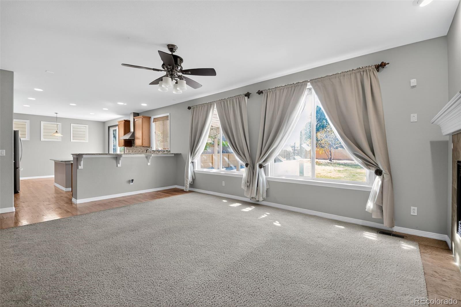 11036 Glengate Circle Highlands Ranch, CO 80130 - Photo 8 of 31 an empty room with windows and entryway
