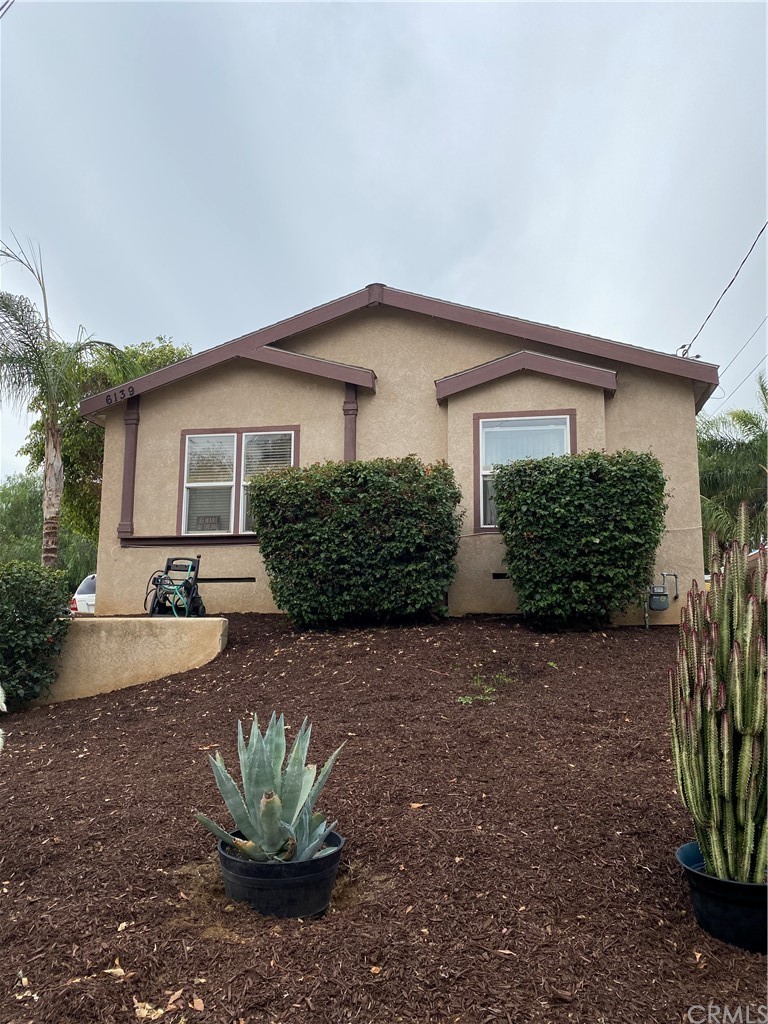 6139 Vera Street Riverside, CA 92504 - Photo 1 of 1 a view of a house with a yard and plants
