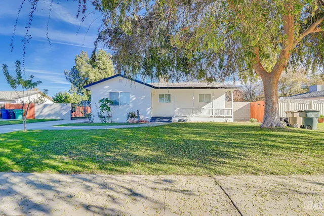 a kitchen with cabinets a sink and appliances