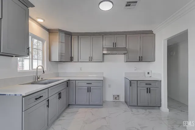 a front view of house with yard and trees