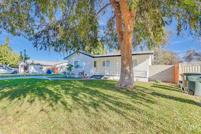 a kitchen with cabinets appliances and a window