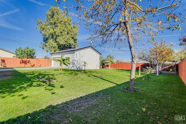 a view of a backyard with a garden