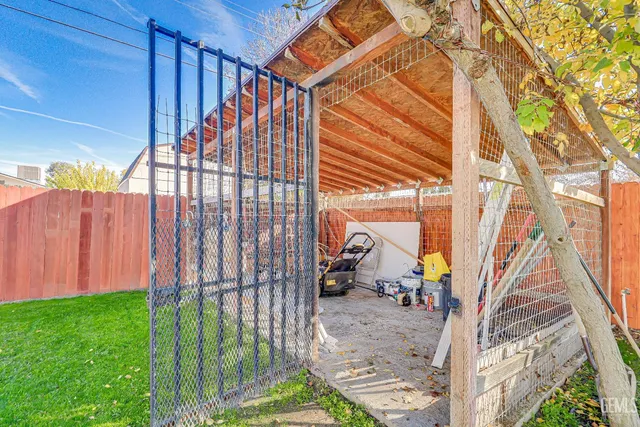 a view of a backyard with a small cabin