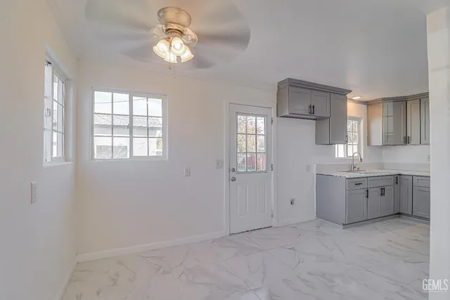 a view of a kitchen with a dishwasher cabinet and cabinets