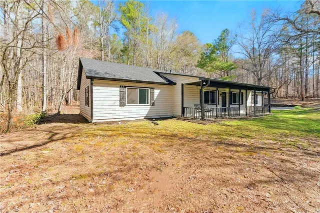 a house that has a tree in front of it