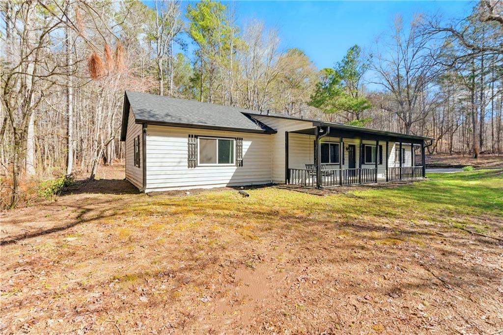 a house that has a tree in front of it