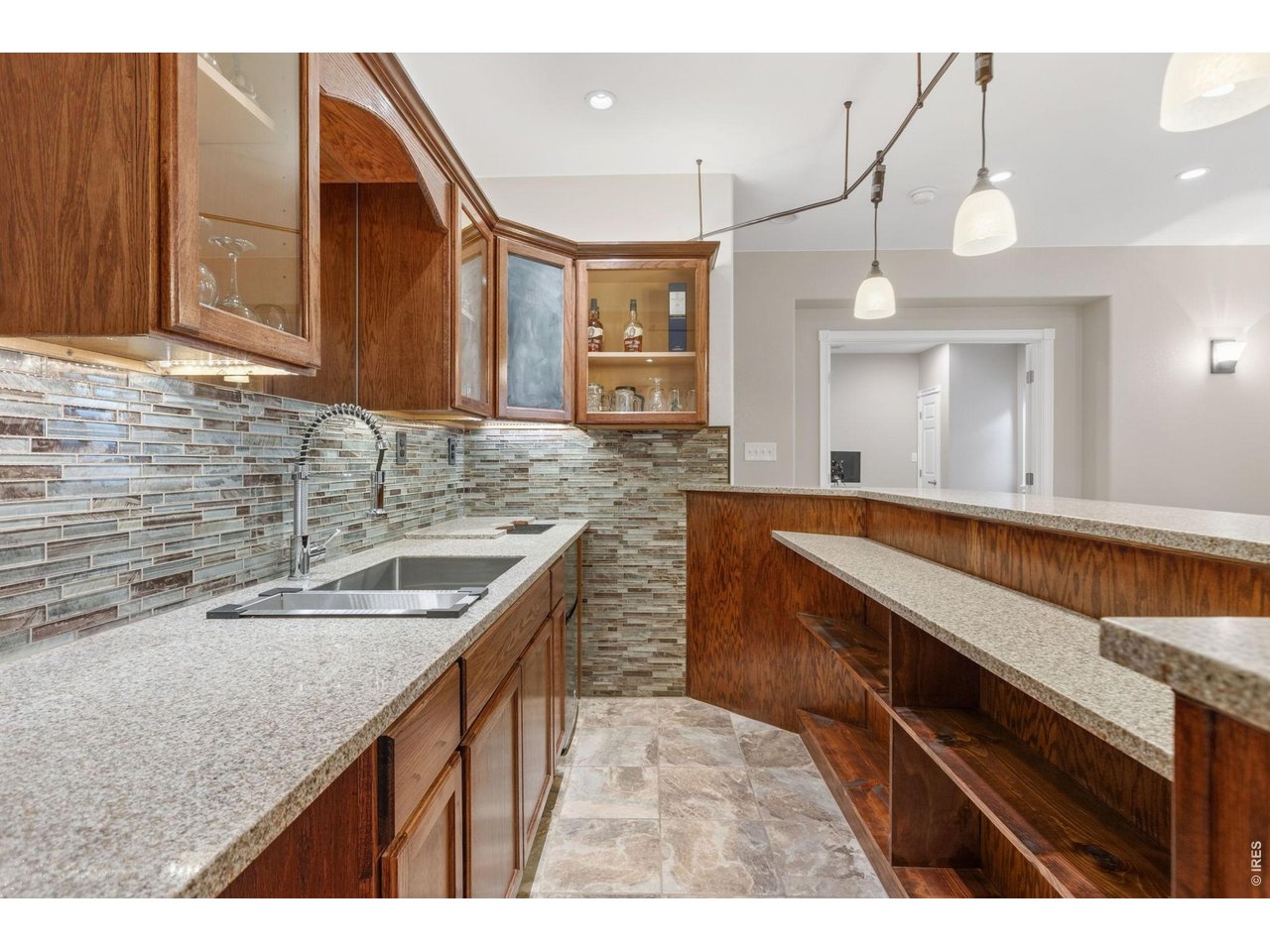 600 Botley Drive Windsor, CO 80550 - Photo 33 of 40 Basement wet bar with under cabinet lights!