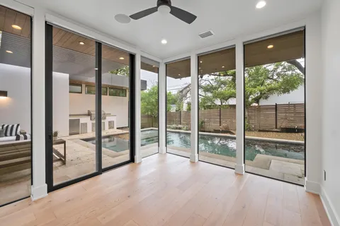 a view of room with window and ceiling fan