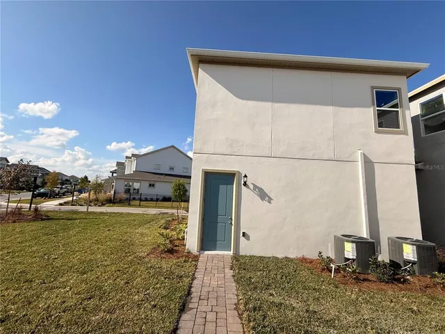 a view of a patio with a yard