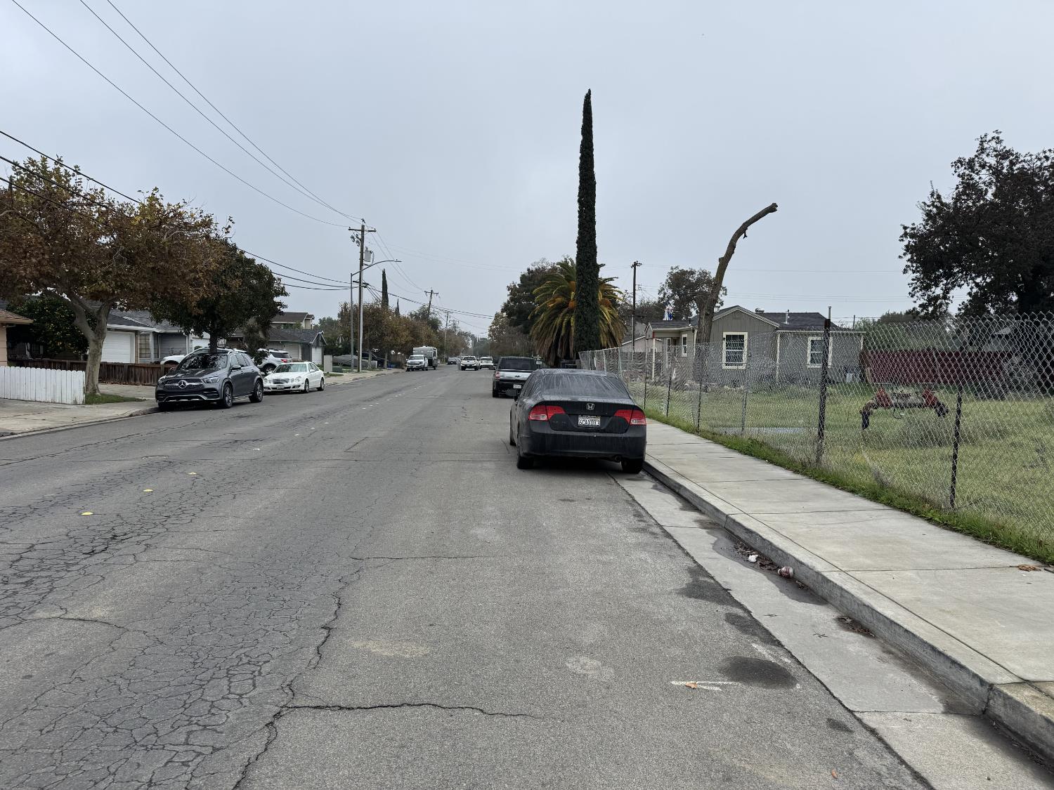 262 Clover Road Tracy, CA 95376 - Photo 11 of 15 a view of a city street with parked cars