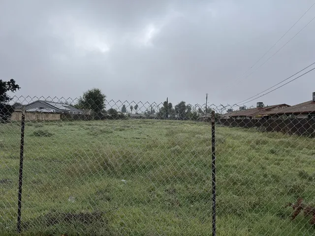 a view of a field with an outdoor space