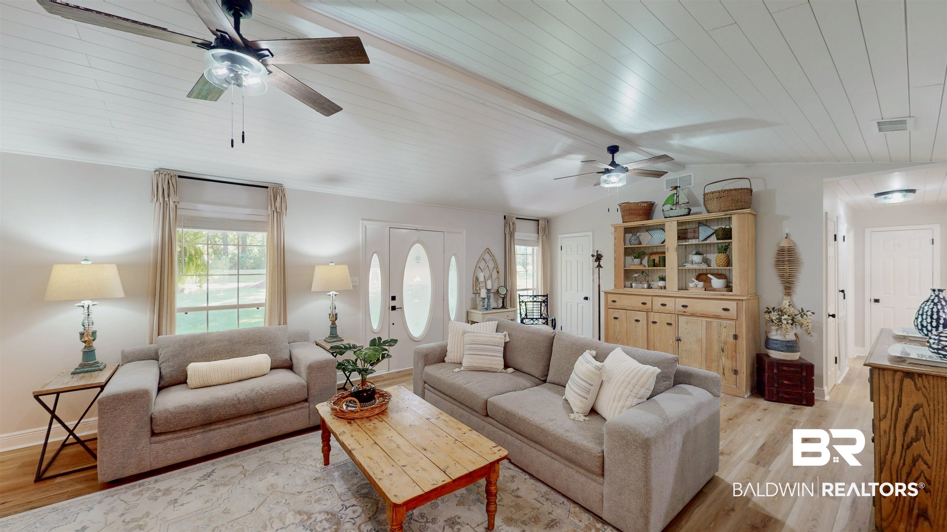9902 Clarke Ridge Road Foley, AL 36535 - Photo 14 of 61 Living room featuring light wood finished floors, lofted ceiling, ceiling fan, and visible vents