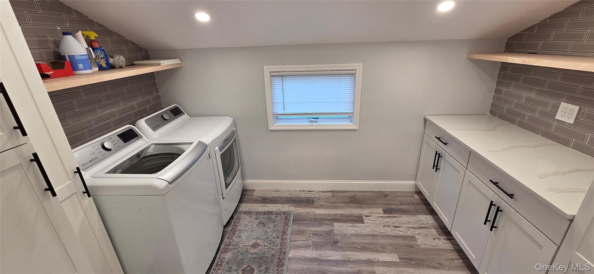 522 Moriches Road St. James, NY 11780 - Photo 16 of 49 a storage room with washer and dryer
