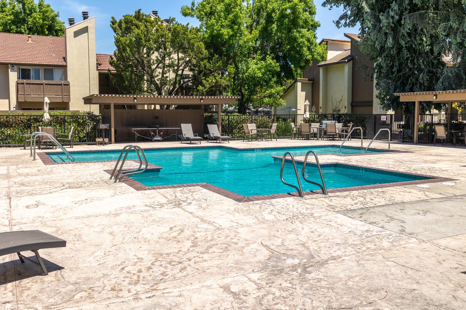 3700 Tully Road, Unit 5 Modesto, CA 95356 - Photo 28 of 38 a view of a swimming pool with a lounge chair