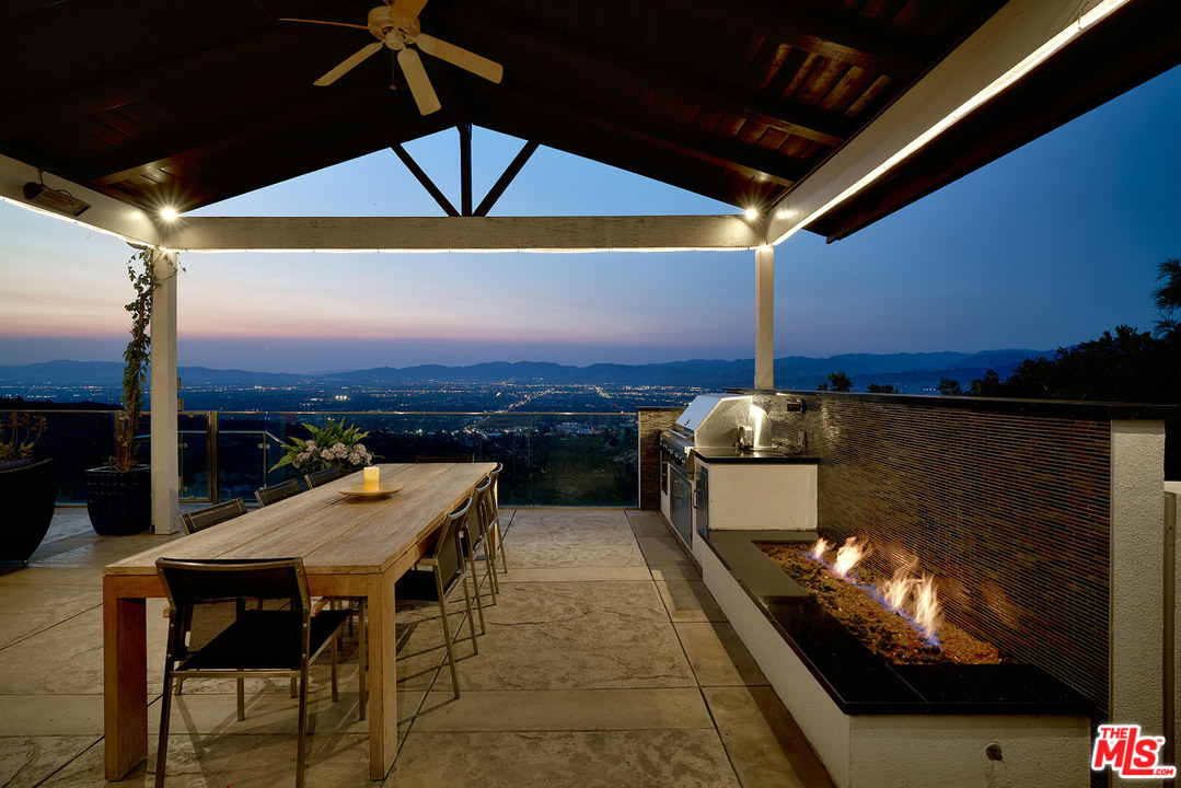 8647 Edwin Drive Los Angeles, CA 90046 - Photo 13 of 32 a view of a balcony dining table and chairs