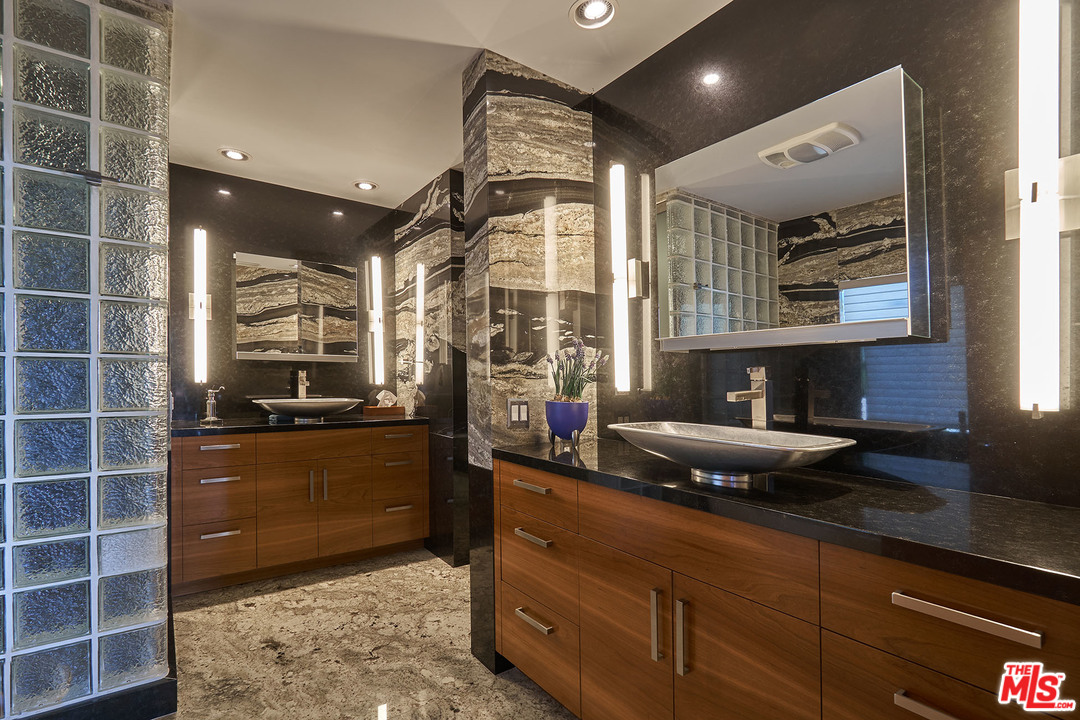 8647 Edwin Drive Los Angeles, CA 90046 - Photo 16 of 32 a kitchen with stainless steel appliances granite countertop a sink and cabinets