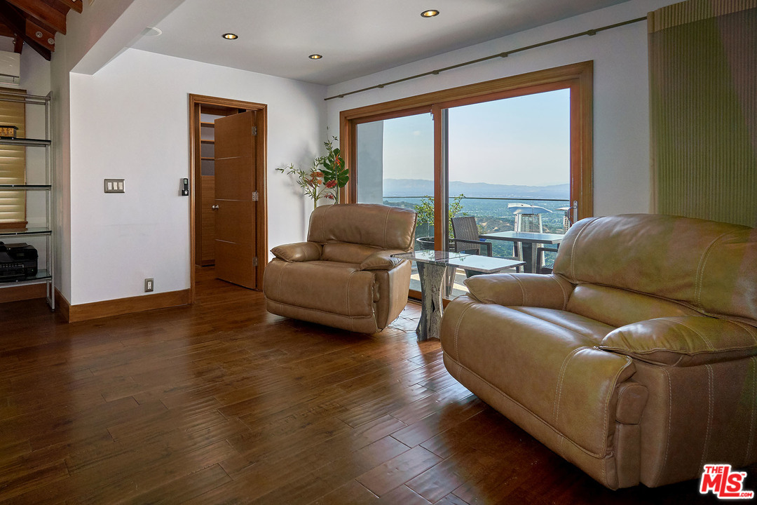 8647 Edwin Drive Los Angeles, CA 90046 - Photo 24 of 32 a living room with furniture and a large window