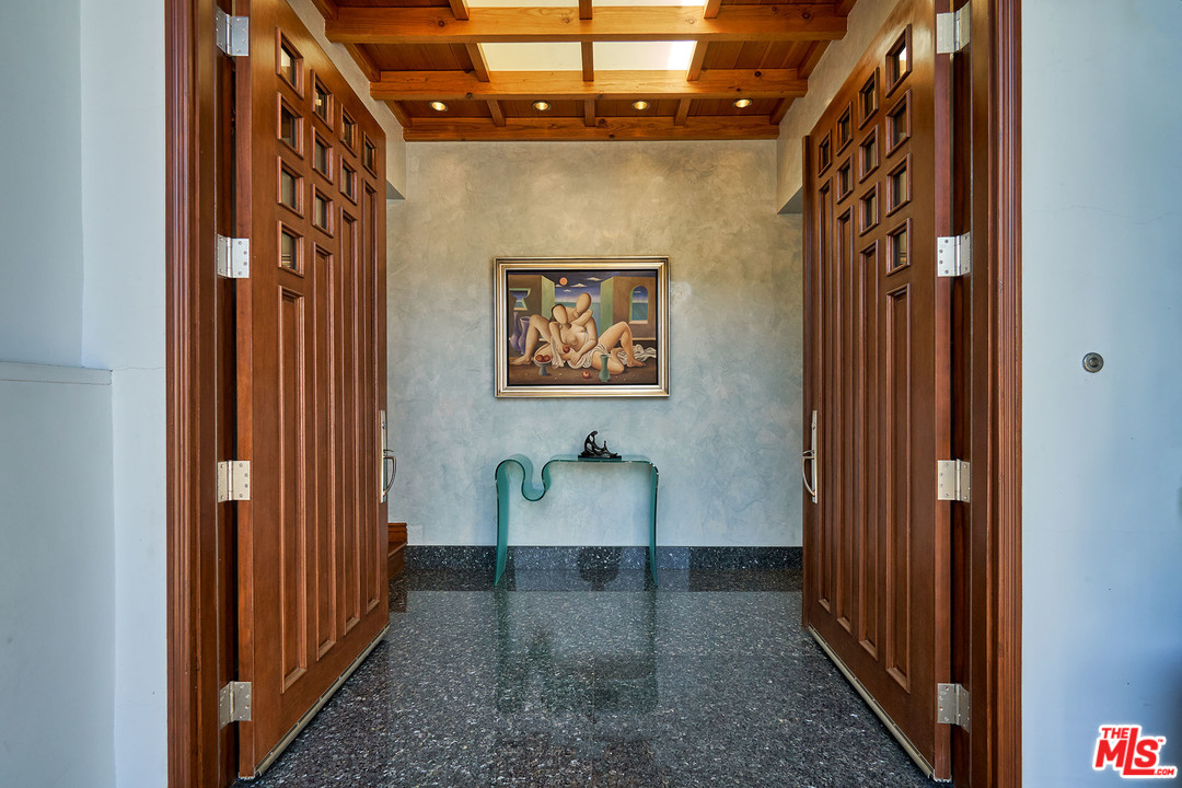 8647 Edwin Drive Los Angeles, CA 90046 - Photo 30 of 32 a hallway with painting on the wall