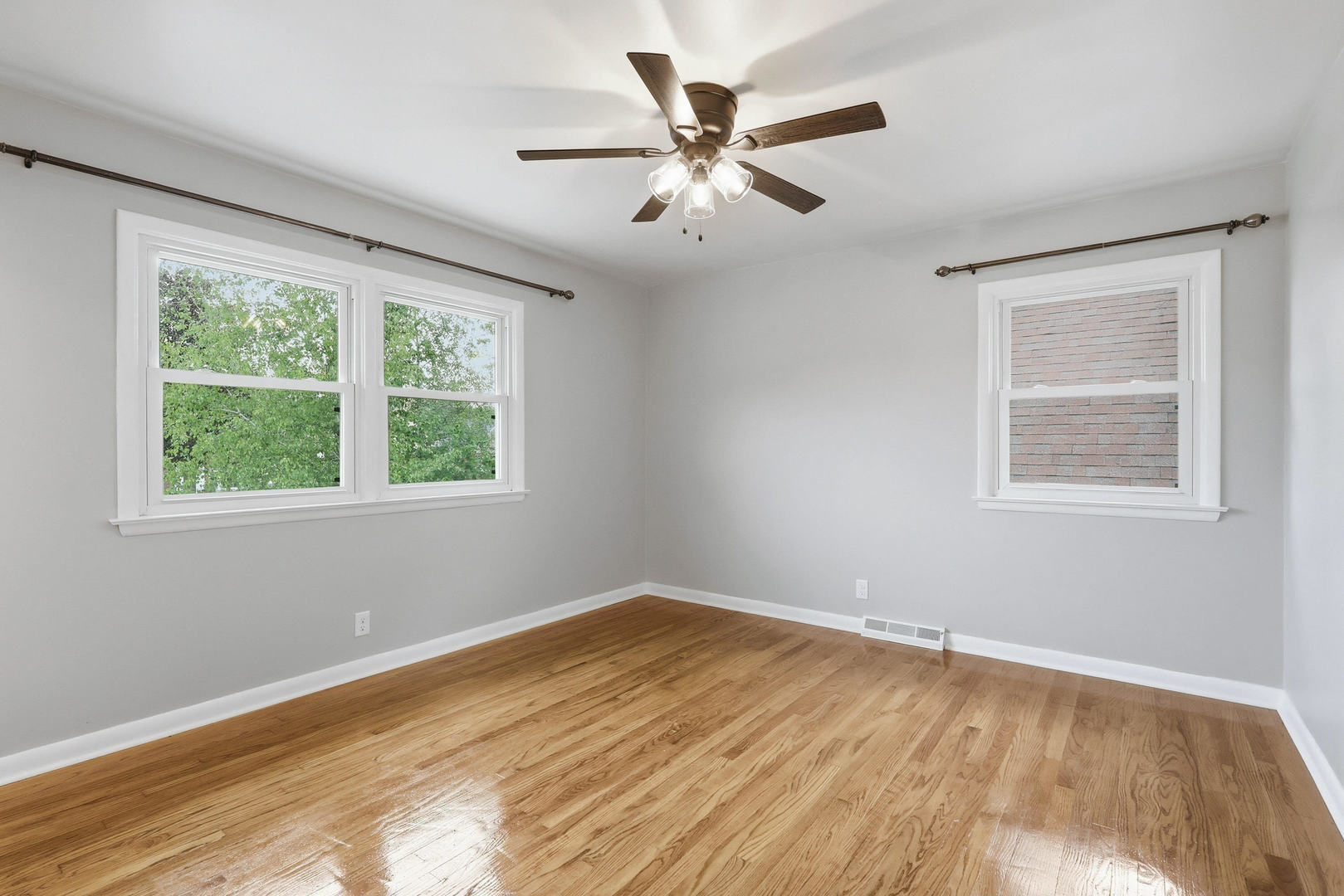 2528 28th Street Moline, IL 61265 - Photo 17 of 35 a view of empty room with wooden floor and fan