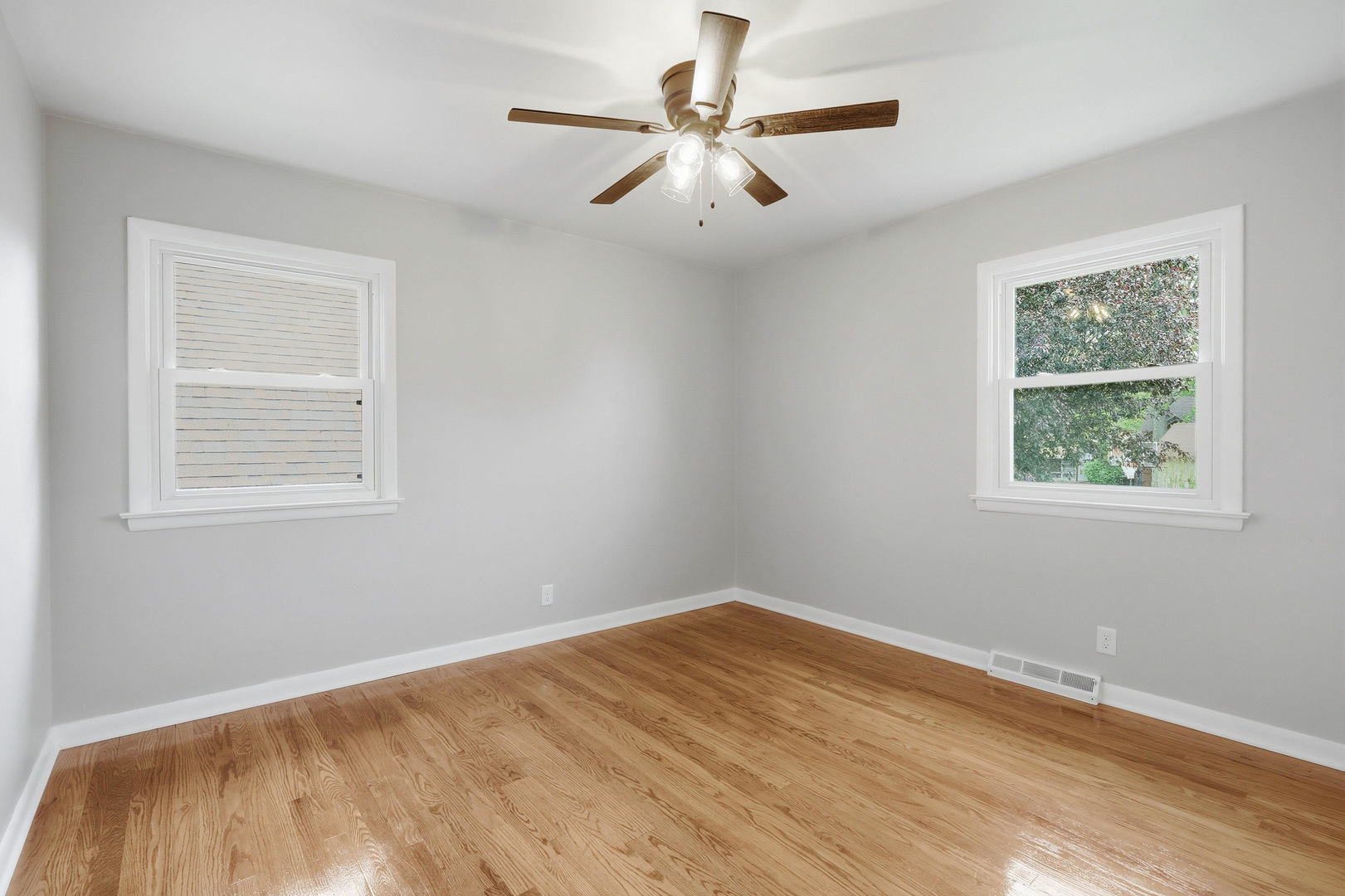 2528 28th Street Moline, IL 61265 - Photo 21 of 35 a view of empty room with wooden floor and fan