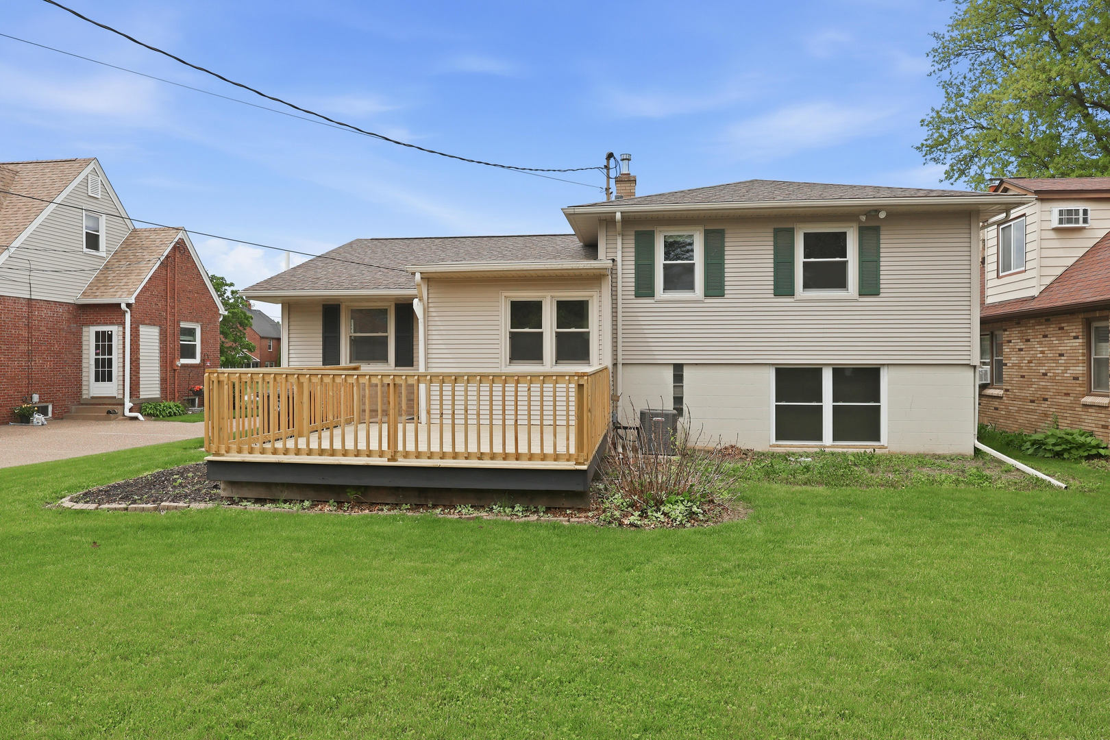 2528 28th Street Moline, IL 61265 - Photo 33 of 35 a view of a house with a backyard and deck