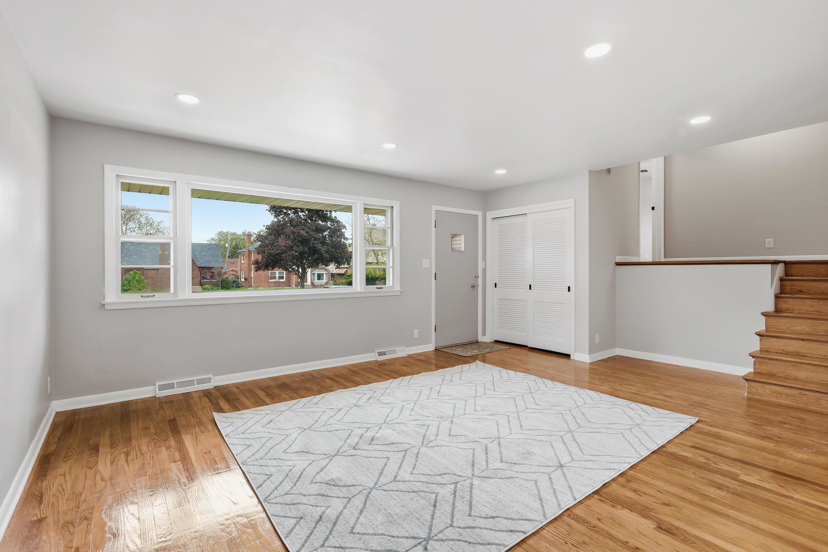 2528 28th Street Moline, IL 61265 - Photo 9 of 35 a view of empty room with wooden floor and fan