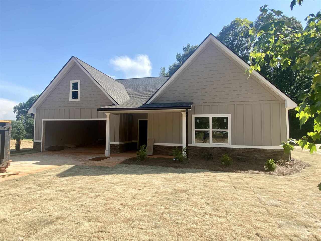 1372 McCoy Bridge Road, Unit 10B Homer, GA 30547 - Photo 1 of 1 a front view of a house with a yard