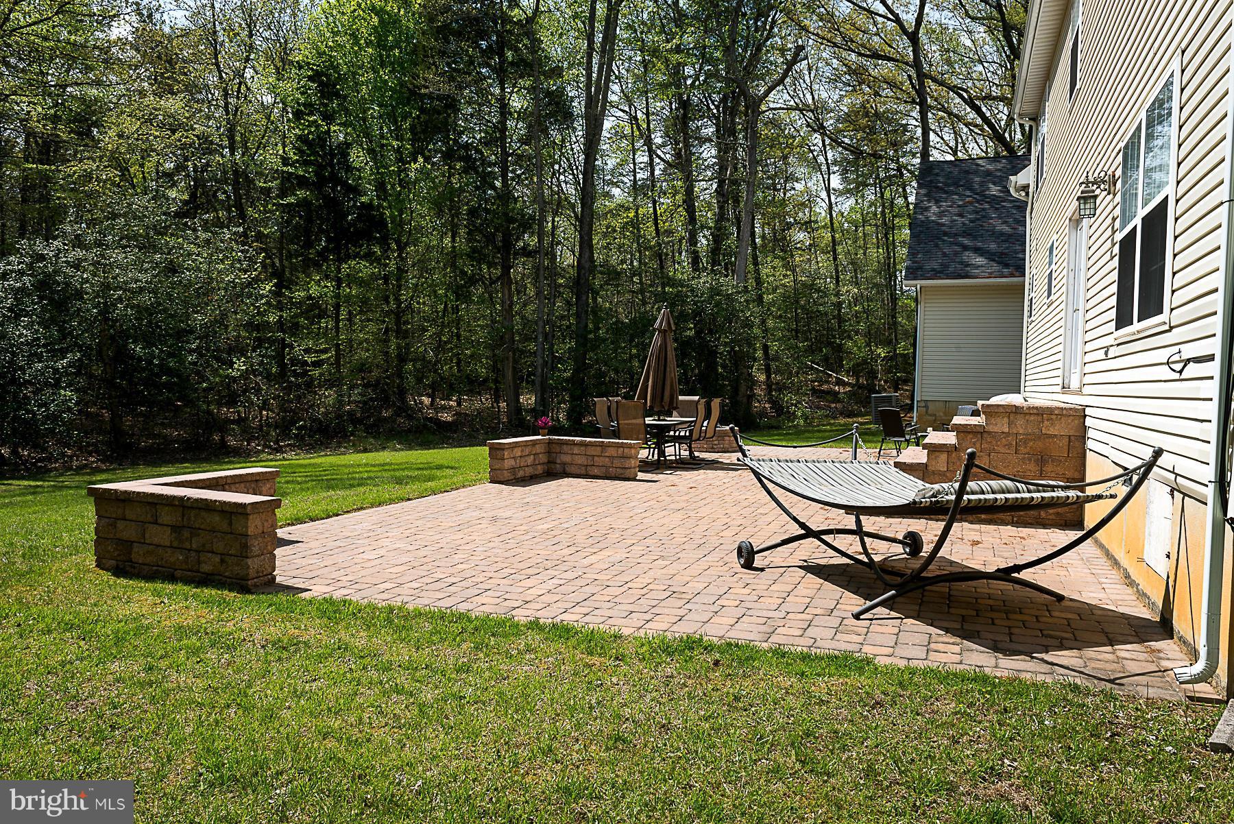 7105 Henson Landing Road Welcome, MD 20693 - Photo 26 of 30 Large custom patio area with fire pit