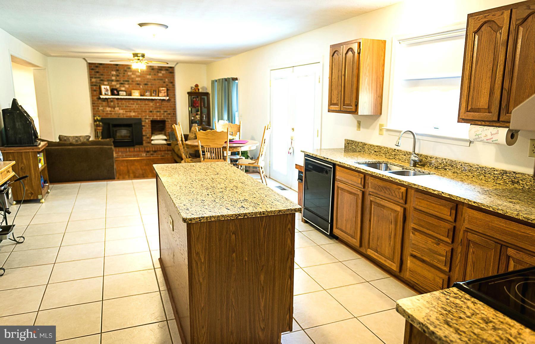 7105 Henson Landing Road Welcome, MD 20693 - Photo 5 of 30 Kitchen granite tops, island, and table area
