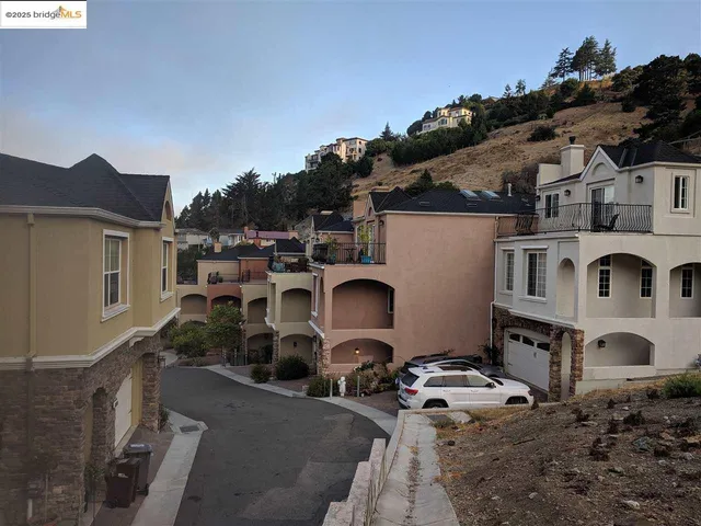 a view of a car parked in front of a house