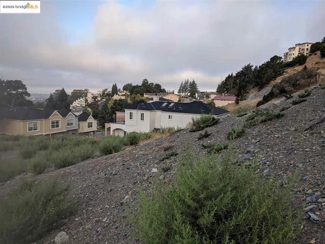 a view of a town with mountains in the background