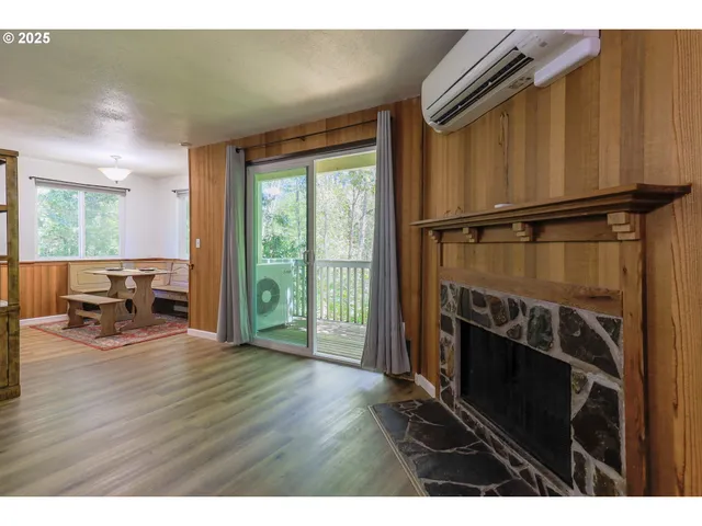 a view of livingroom with furniture window and wooden floor