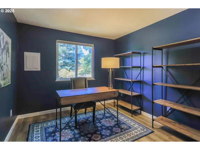 a workspace with furniture and window