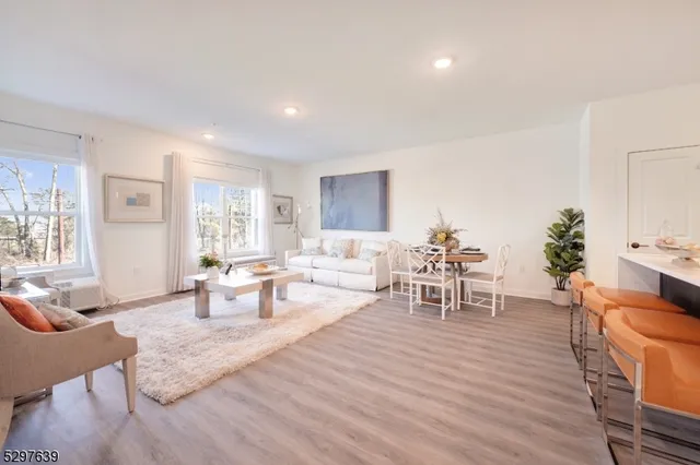 a living room with furniture and a table
